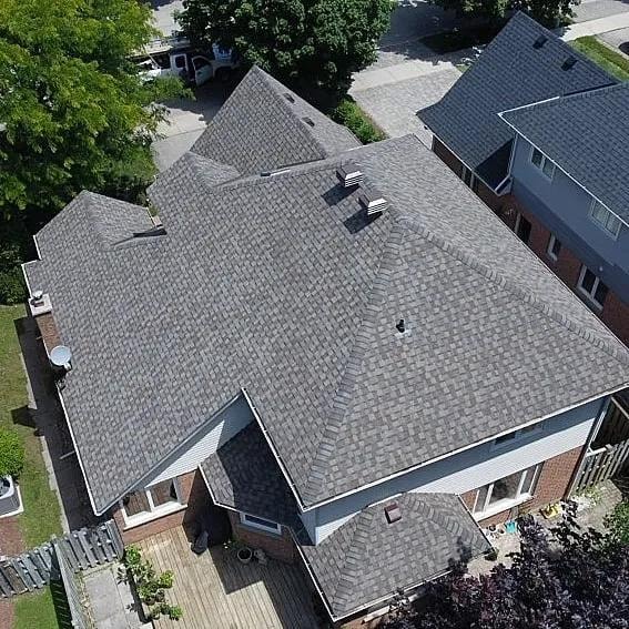 New shingle installation on suburban home