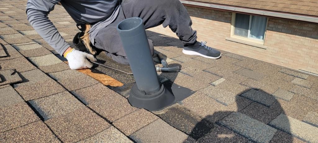 Metal roof flashing installed around a chimney