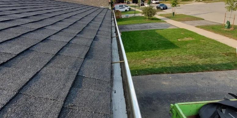 Cleaning gutters after roof installation