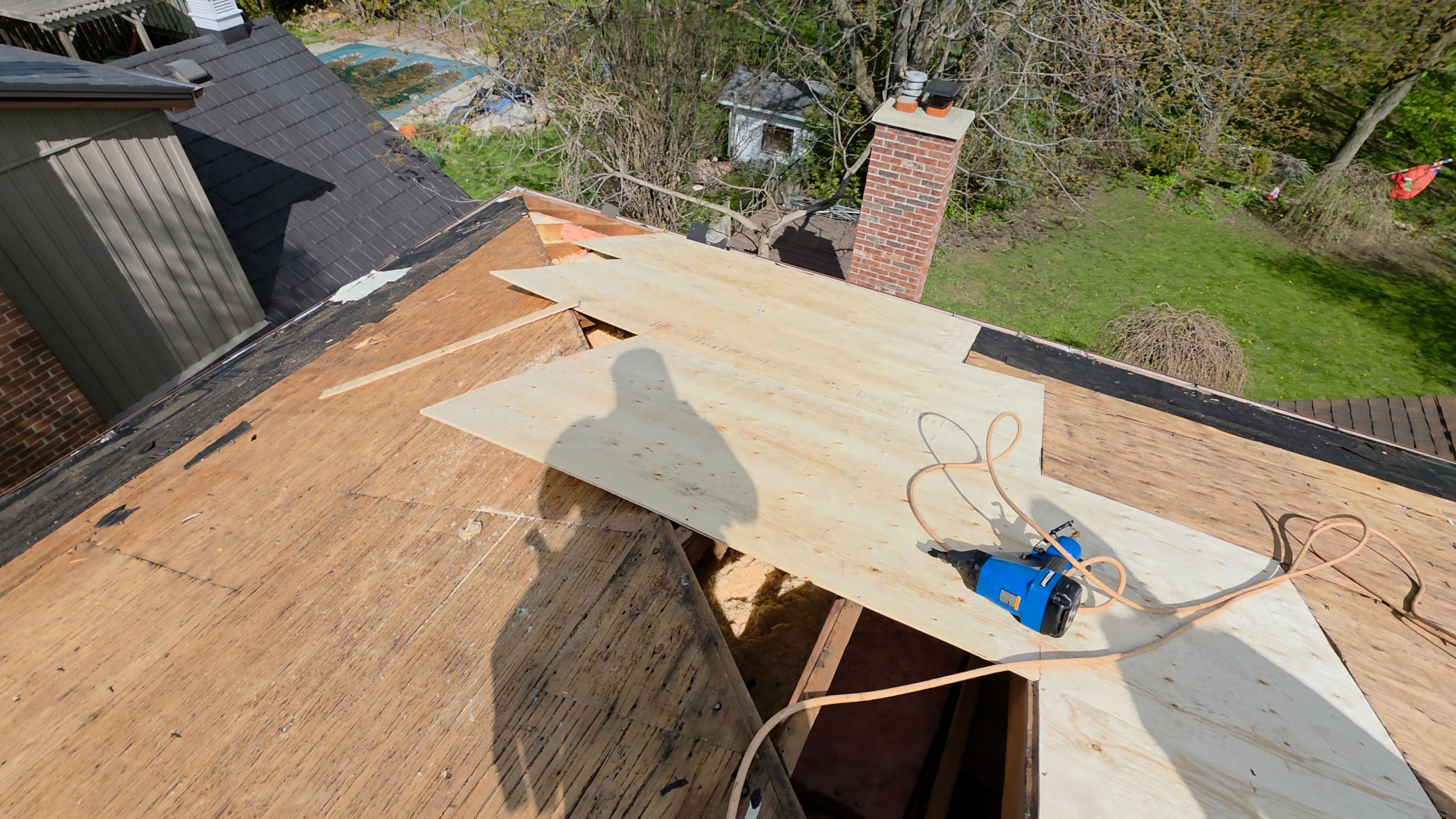 New plywood sheeting installed on roof deck