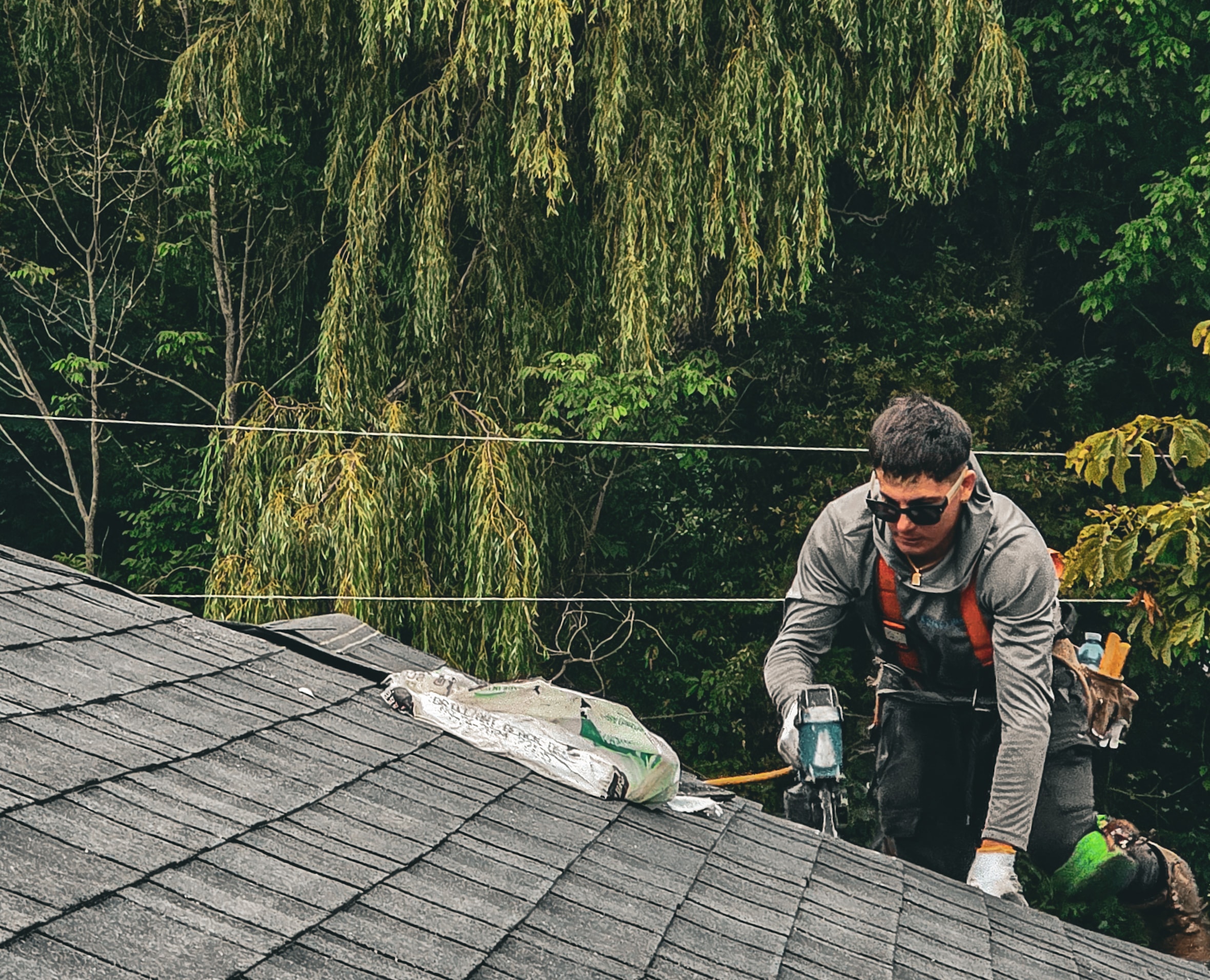 New asphalt shingles being installed on residential roof